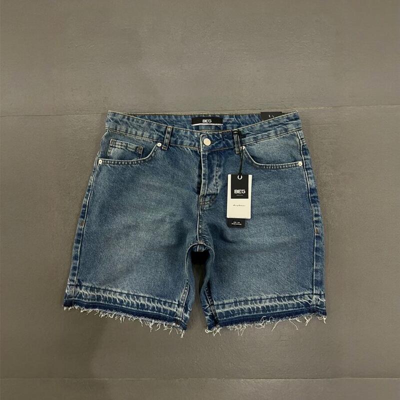 Shorce xhinse blu me buzë të papërpunuar – foto produkti